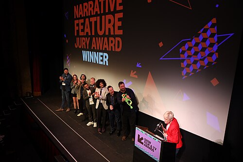 Cast and crew of Bob Trevino Likes It on stage at the SXSW 2024 Film Festival award ceremony that took place at the Paramount Theatre in Austin, Texas. The film, directed by Tracie Laymon, won the SXSW 2024 Narrative Feature Competition Award.