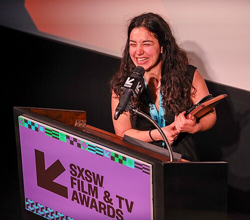 Cécile Cournelleon on stage at the SXSW 2024 Film Festival award ceremony that took place at the Paramount Theatre in Austin, Texas. Cournelleon's music video for "Mom told you so" by Célen won the SXSW 2024 Music Video Competition Award.