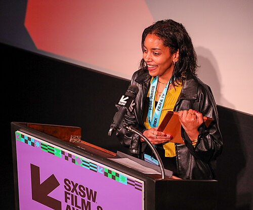 Fatima Wardy on stage at the SXSW 2024 Film Festival award ceremony that took place at the Paramount Theatre in Austin, Texas. Wardy won the Texas Shorts Competition Special Jury Award for the film Hair Care.