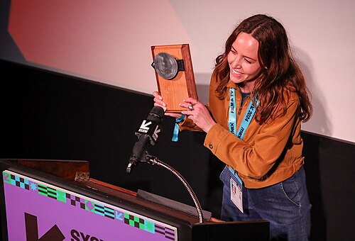 Kate Dumke on stage at the SXSW 2024 Film Festival award ceremony that took place at the Paramount Theatre in Austin, Texas. Preconceived, directed by Sabrine Keane and Kate Dumke, won the SXSW 2024 Janet Pierson Champion Award.