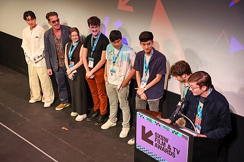 The cast and crew of Marvin Is Sorry on stage at the SXSW 2024 Film Festival award ceremony that took place at the Paramount Theatre in Austin, Texas. The pilot won the SXSW 2024 Independent TV Pilot Competition Award.