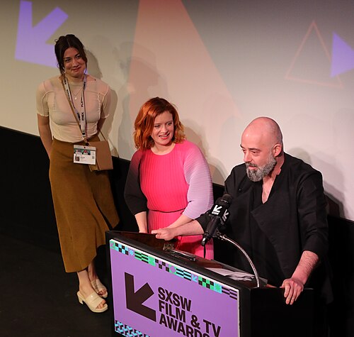 Niki Smit, Sarah Ticho, and Anna Firbank on stage at the SXSW 2024 Film Festival award ceremony that took place at the Paramount Theatre in Austin, Texas. Their film, Soul Paint, won the SXSW 2024 XR Experience Competition Special Jury Award.