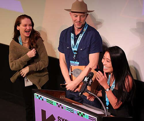 Carina Mia Wong, Alex Simmons, and Jennifer Wood of We Can Be Heroes on stage at the SXSW 2024 Film Festival award ceremony that took place at the Paramount Theatre in Austin, Texas. Carina Mia Wong and Alex Simmons won the SXSW 2024 Documentary Feature Competition Special Jury Award.