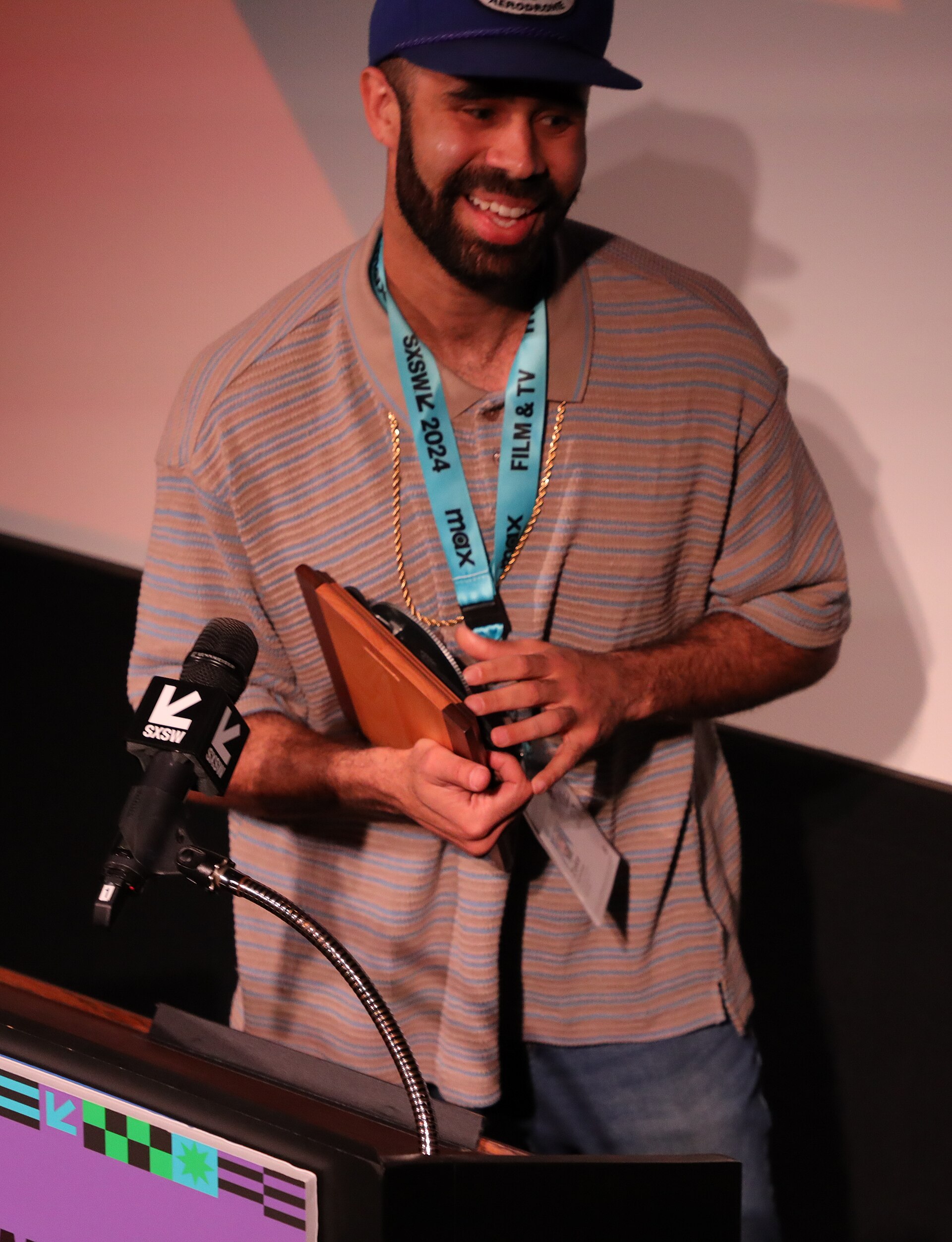 Zeke Nicholson on stage at the SXSW 2024 Film Festival award ceremony that took place at the Paramount Theatre in Austin, Texas. Nicholson was the winner of the SXSW 2024 Independent TV Pilot Competition Special Jury Award.