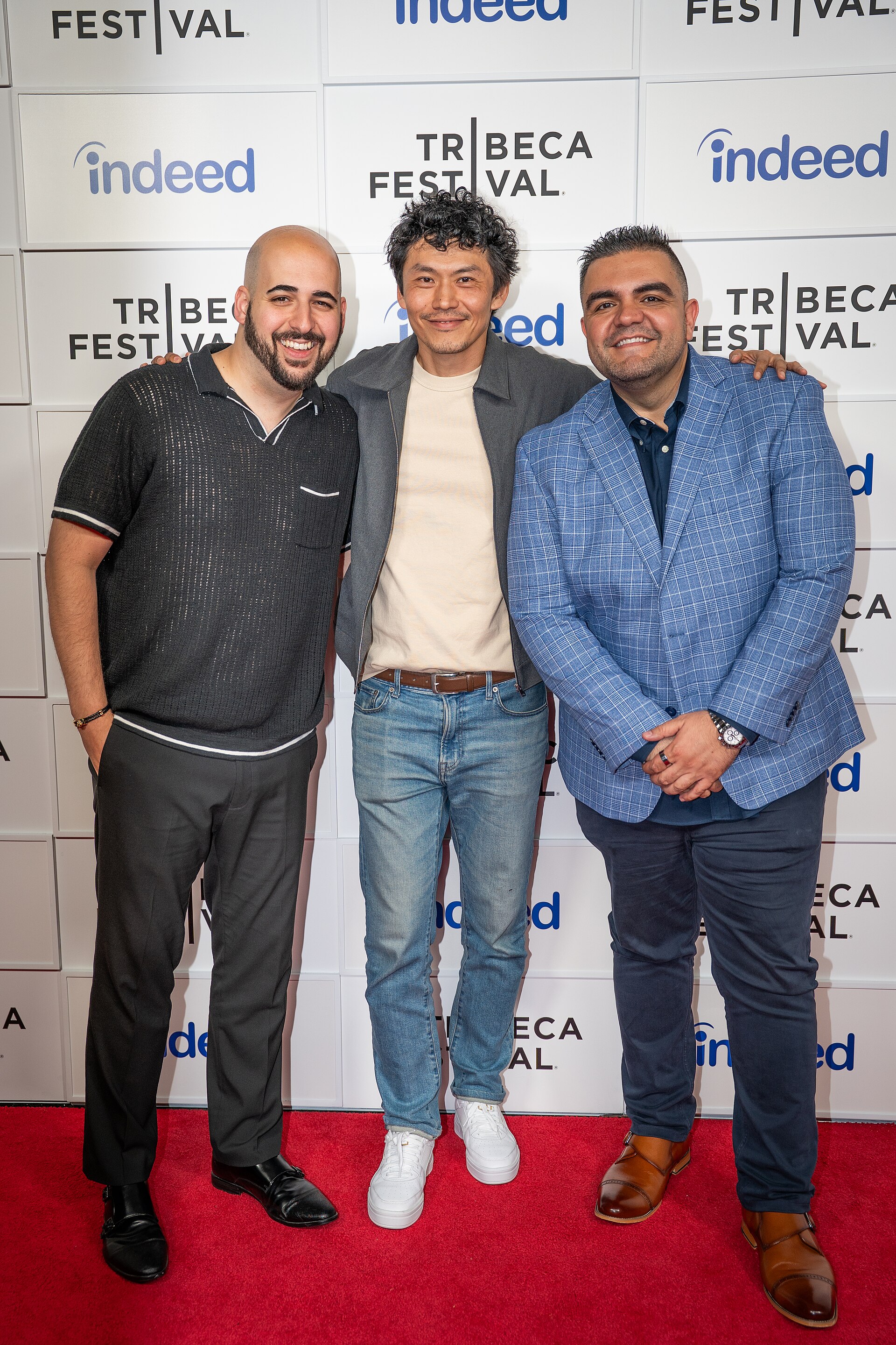 Scott Aharoni, Frank Sun, and Alex Constantin at a 2025 Tribeca Film Festival red carpet in New York City for the film We Are Kings.