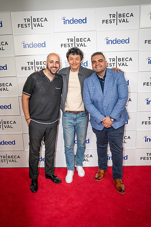 Scott Aharoni, Frank Sun, and Alex Constantin at a 2025 Tribeca Film Festival red carpet in New York City for the film We Are Kings.