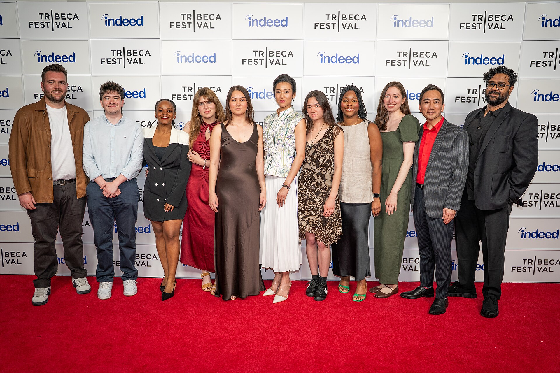 Seán Mackey, Nicholas Smyth, Tracey Murray, Maria Elena Capra, Olivia Owyeung, Quanna Luo Masterson, Leah Dawson, Toyosi Fuwa, Claudia Morles Sosa, David K. S. Tse, and Harpal Mudhar, , at a 2025 Tribeca Film Festival red carpet in New York City for the film Red Egg and Ginger Face.