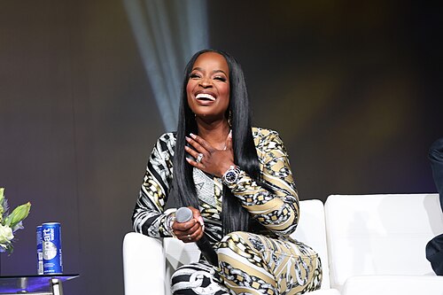 Shamea Morton at Essence Fest 2025 speaking at the GBEF