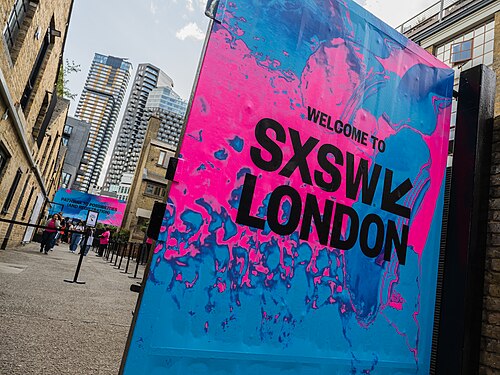 SXSW London 2025. Badge collection point at Shoreditch Studios.