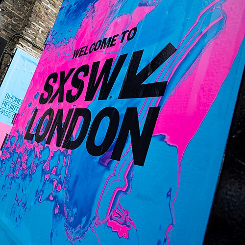 SXSW London 2025. Badge collection point at Shoreditch Studios.