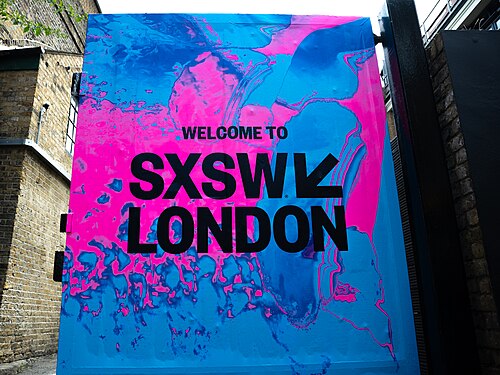 SXSW London 2025. Badge collection point at Shoreditch Studios.