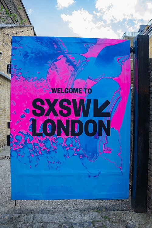 SXSW London 2025. Badge collection point at Shoreditch Studios.