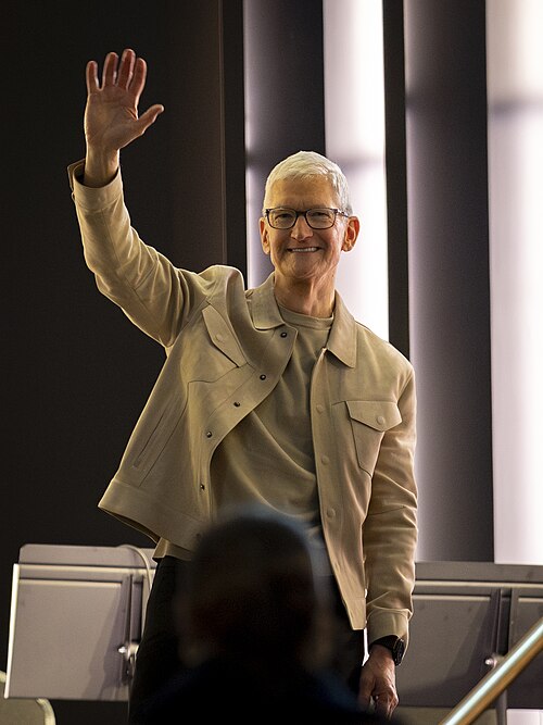 Tim Cook waves to attendees during Apple’s 50th-anniversary kickoff event at Apple’s Grand Central Terminal store in New York City on March 13, 2026.