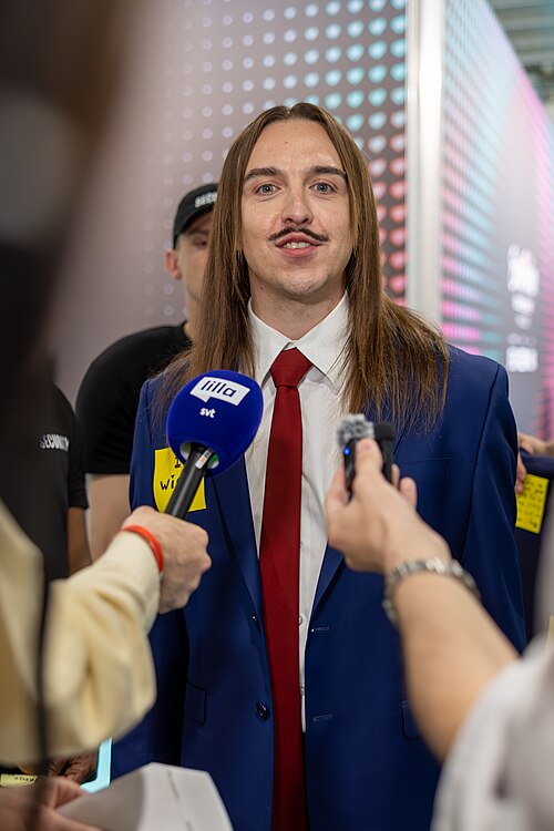 Tommy Cash, representing Estonia, being interviewed at Eurovision 2025 in Basel, Switzerland.