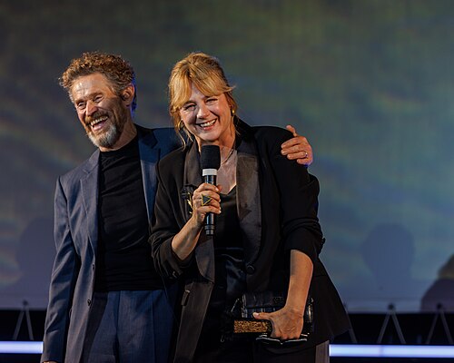 Willem Dafoe and Emma Suarez speak on stage before the 'The Birthday Party' screening during the 78th Locarno Film Festival on August 07, 2025 in Locarno, Switzerland.