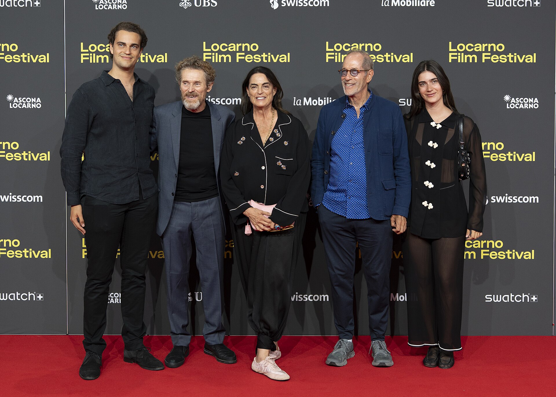 Actor Willem Dafoe, president Maja Hoffmann and family at the 78th Locarno Film Festival red carpet.