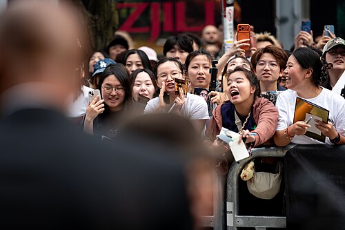 Fans of Peter Ho-sun Chan call for security to close King Street to allow him to greet his fans. At the screening of The Road Not Taken at the 2026 Toronto International Film Festival.