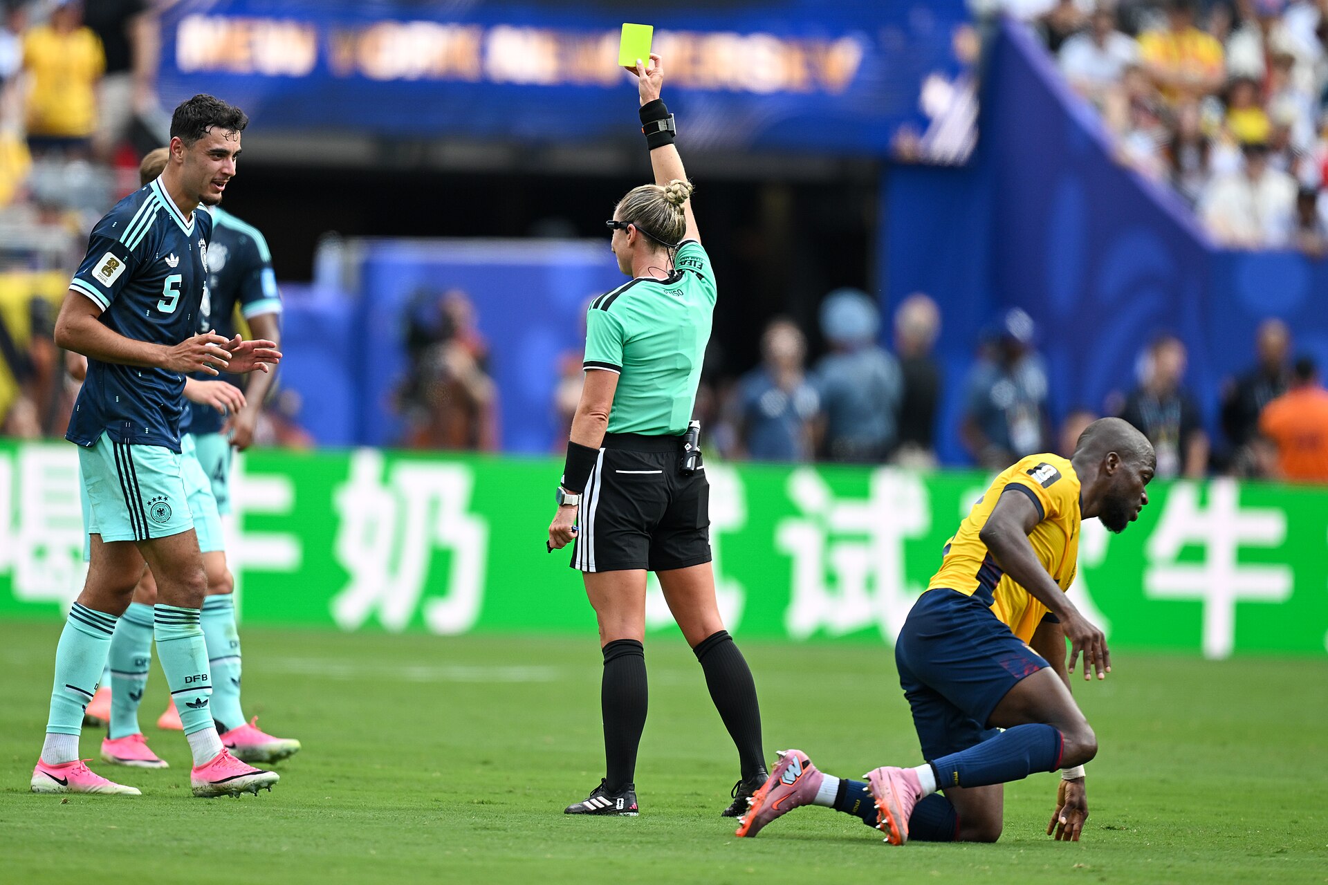 EAST RUTHERFORD, UNITED STATES - June 25: Referee Tori Penso  shows yellow card to Aleksandar Pavlović #5 of Germany during the FIFA World Cup 2026 Group E match between Ecuador  and  Germany on June 25, 2026 MetLife Stadium, East Rutherford, New Jersey