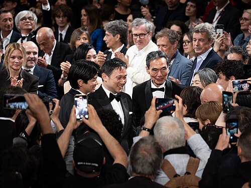 MAY 16, 2026 - Japanese director Ryusuke Hamaguchi and Japanese actors Kyōzō Nagatsuka and Kodai Kurosaki pose during the standing ovation for their film All Of A Sudden at 2026 Cannes Film Festival.