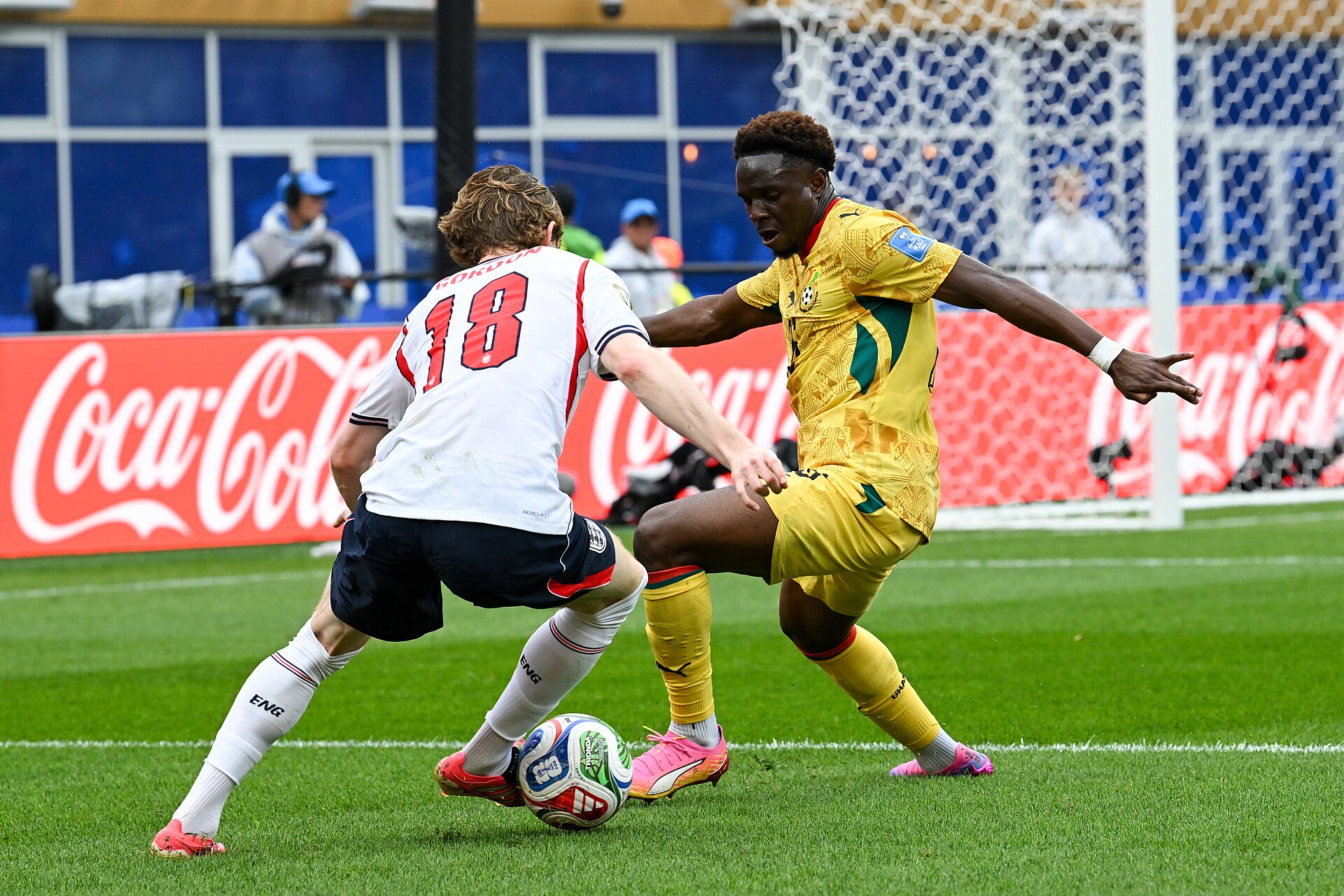 FOXBOROUGH, UNITED STATES - June 23: Marvin Senaya #26 of Ghana is in action against Anthony Gordon #18 of England during the FIFA World Cup 2026 Group L match between England and Ghana on June 23, 2026 Boston Stadium , Foxborough, Massachusetts