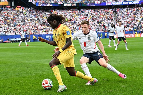 FOXBOROUGH, UNITED STATES - June 23: Caleb Yirenkyi #3 of Ghana is in action against Elliot Anderson #8of England during the FIFA World Cup 2026 Group L match between England and Ghana on June 23, 2026 Boston Stadium , Foxborough, Massachusetts