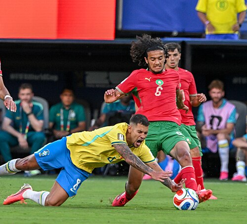 EAST RUTHERFORD, UNITED STATES - June 13: Bruno Guimarães of Brazil competes for the ball against Ismael Saibari and Ayyoub Bouaddi of Morocco during the FIFA World Cup 2026 Group C match between Brazil and Morocco on June 13, 2026