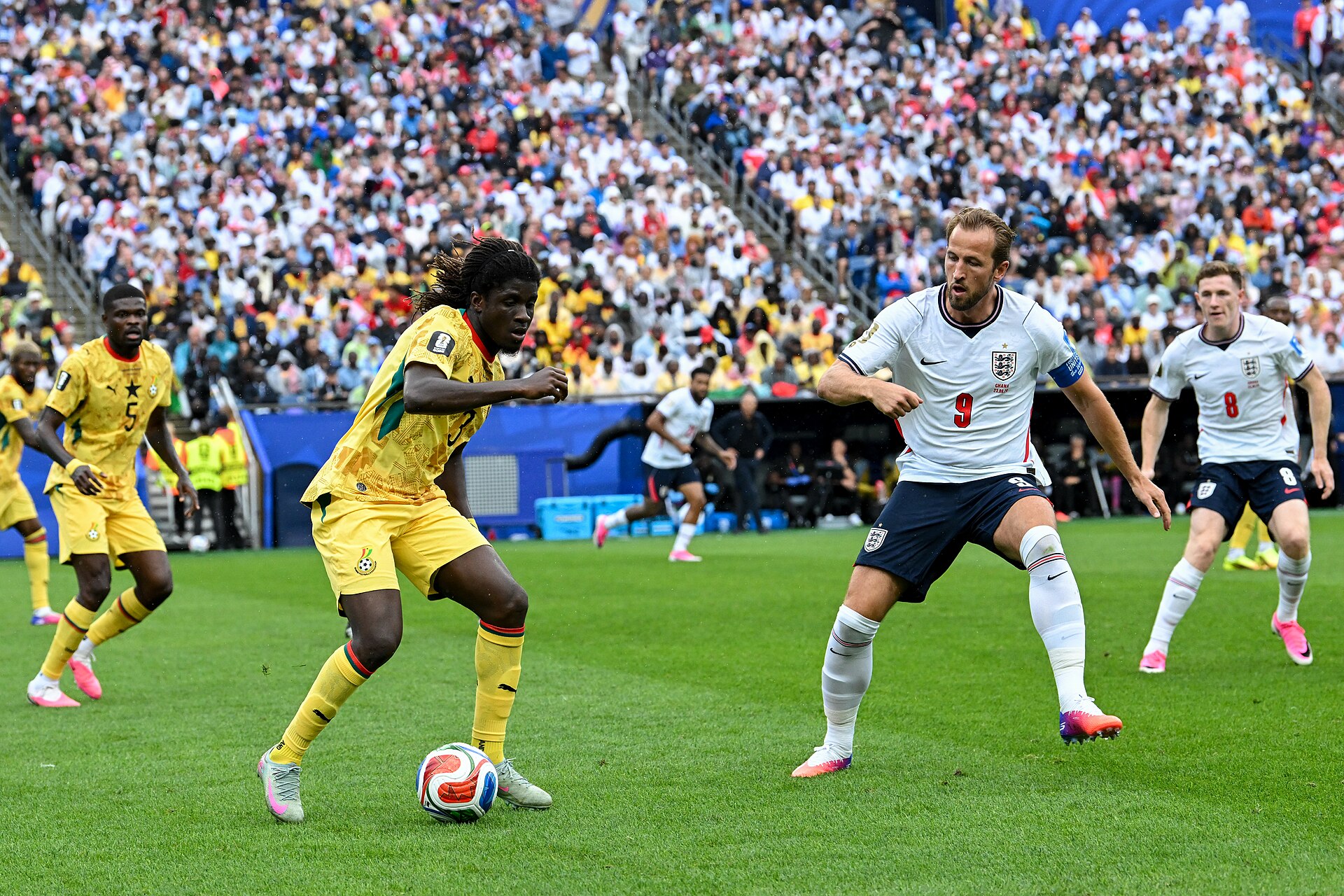 FOXBOROUGH, UNITED STATES - June 23: Caleb Yirenkyi #3 of Ghana is in action against Harry Kane #9 of England during the FIFA World Cup 2026 Group L match between England and Ghana on June 23, 2026 Boston Stadium , Foxborough, Massachusetts