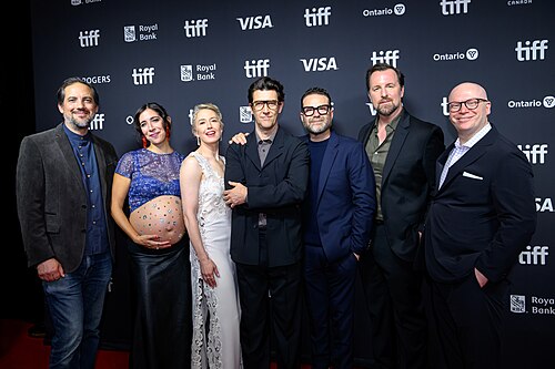 From left to right: Daniel Beckerman, Jordan Hart, Carrie Coon, Guy Nattiv, Eddie Vaisman, Kent Sanderson, Tyler Dinapoli. At the screening of The Liberation at the 2026 Toronto International Film Festival.