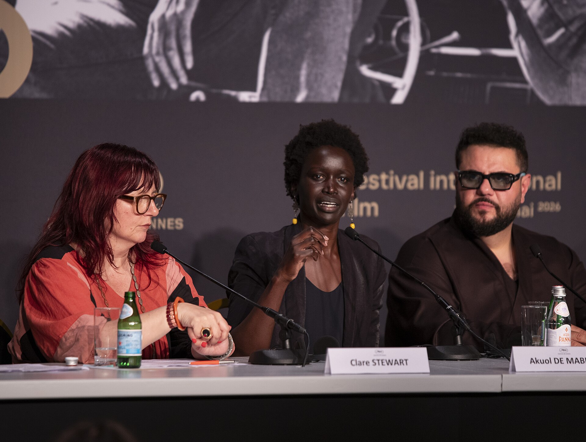 Clare Stewart, Akuol De Mabior, Mohammed Amer at the Displacement Film Fund press conference at 2026 Cannes Film Festival.
