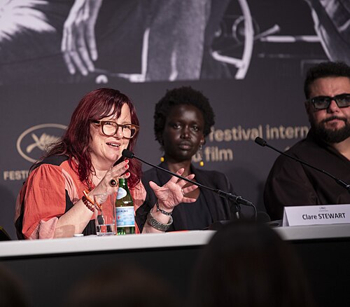 Clare Stewart, Akuol De Mabior, Mohammed Amer at the Displacement Film Fund press conference at 2026 Cannes Film Festival.