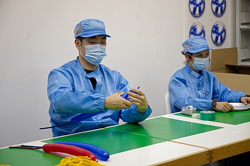 Dahoon Nam, artist, performing for "Jeff Koons Special Sale" at Basel Social Club 2025.