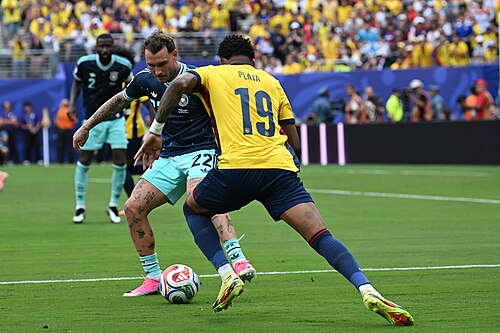 EAST RUTHERFORD, UNITED STATES - June 25: David Raum #22 of Germany is in action against Gonzalo Plata #19 during the FIFA World Cup 2026 Group E match between Ecuador  and  Germany on June 25, 2026 MetLife Stadium, East Rutherford, New Jersey