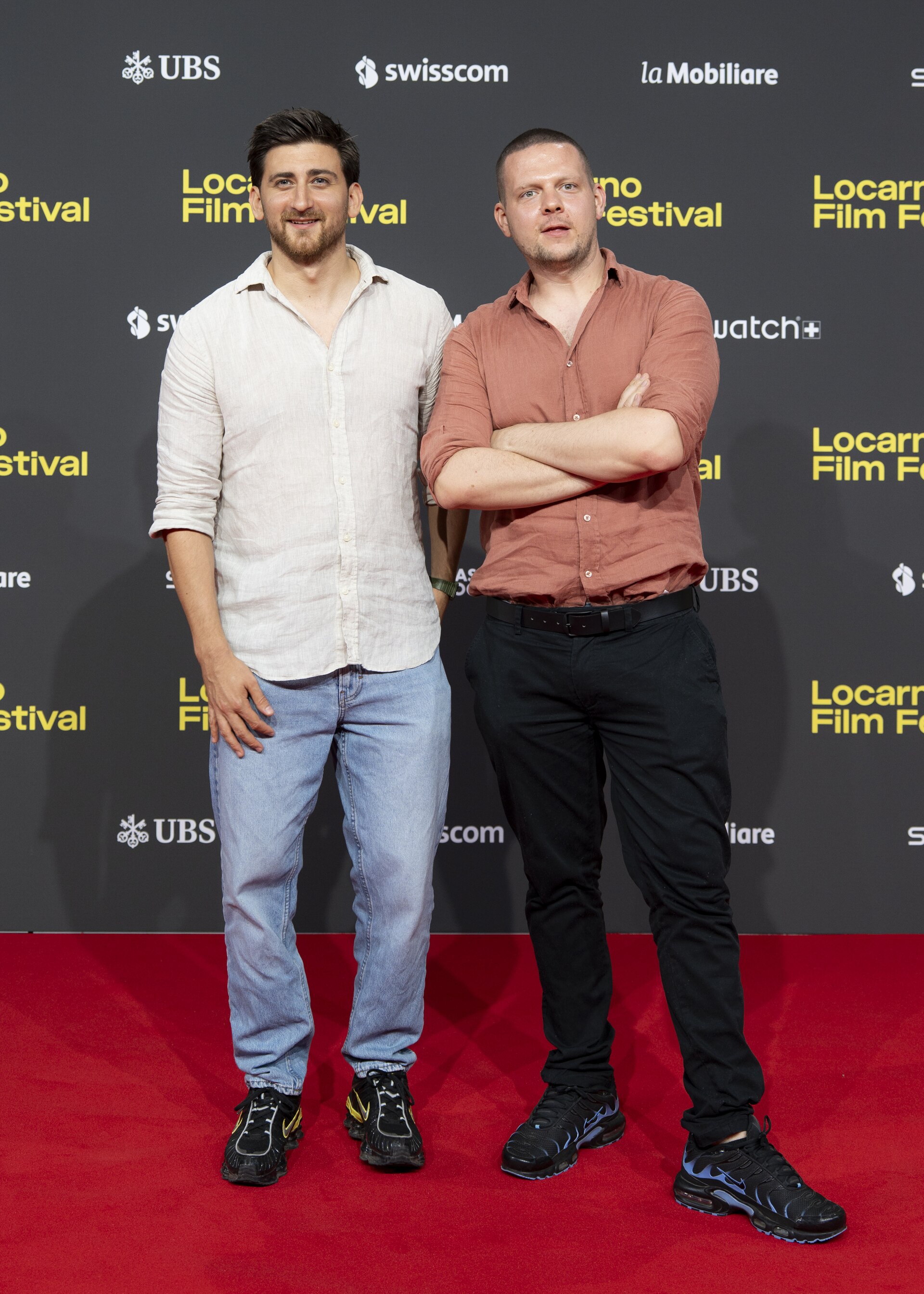 Directors Matija Gluščević and Dušan Zorić at the 78th Locarno Film Festival red carpet for Histerični napad smeha