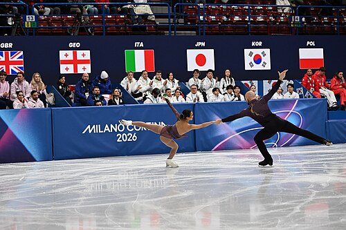 MILAN, ITALY - 06 FEBRUARY 2026: Ellie Kam and Danny O'Shea of United States compete during the Figure Skating Team Event Pair Skating Short Program at the Olympic Winter Games Milano Cortina 2026  Milano Ice Skating Arena on February 06, 2026 in Milan, Italy