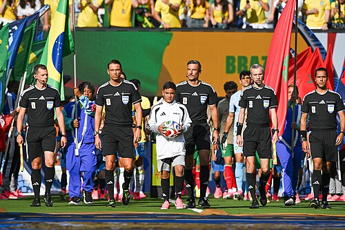 EAST RUTHERFORD, UNITED STATES - June 13: The match officials and mascot lead out the teams during the FIFA World Cup 2026 Group C match between Brazil and Morocco at New York New Jersey Stadium on June 13, 2026 in East Rutherford, New Jersey