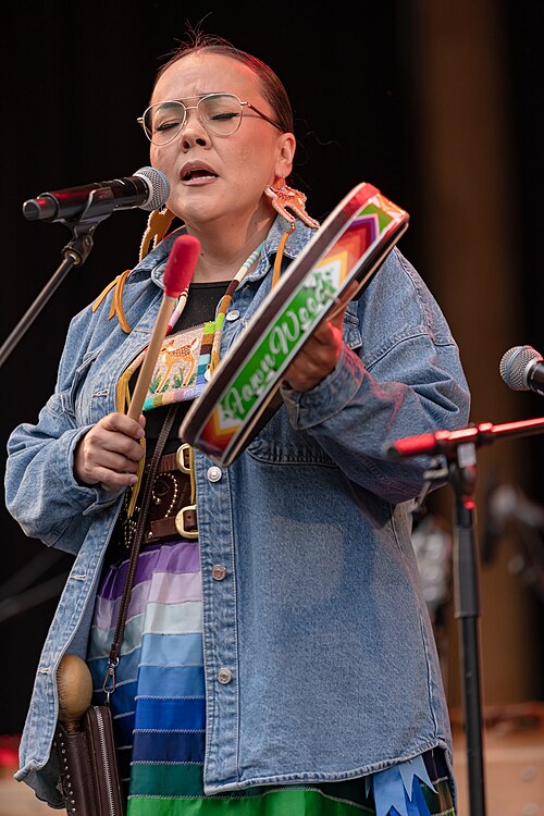Fawn Wood singing traditional Samish and Cree songs with the hand drum at 2025 Riddu Riđđu