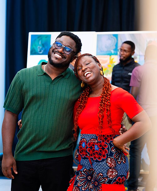 A Photo of Felix Nartey and Jael Boateng at Wikimania 2025 during the poster session