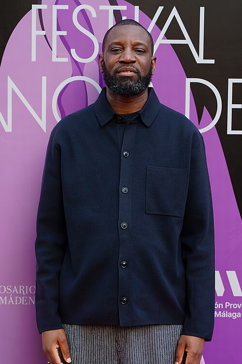 Abd Al Malik on the red carpet at the 2025 Malaga French Film Festival next to the Albéniz Cinema