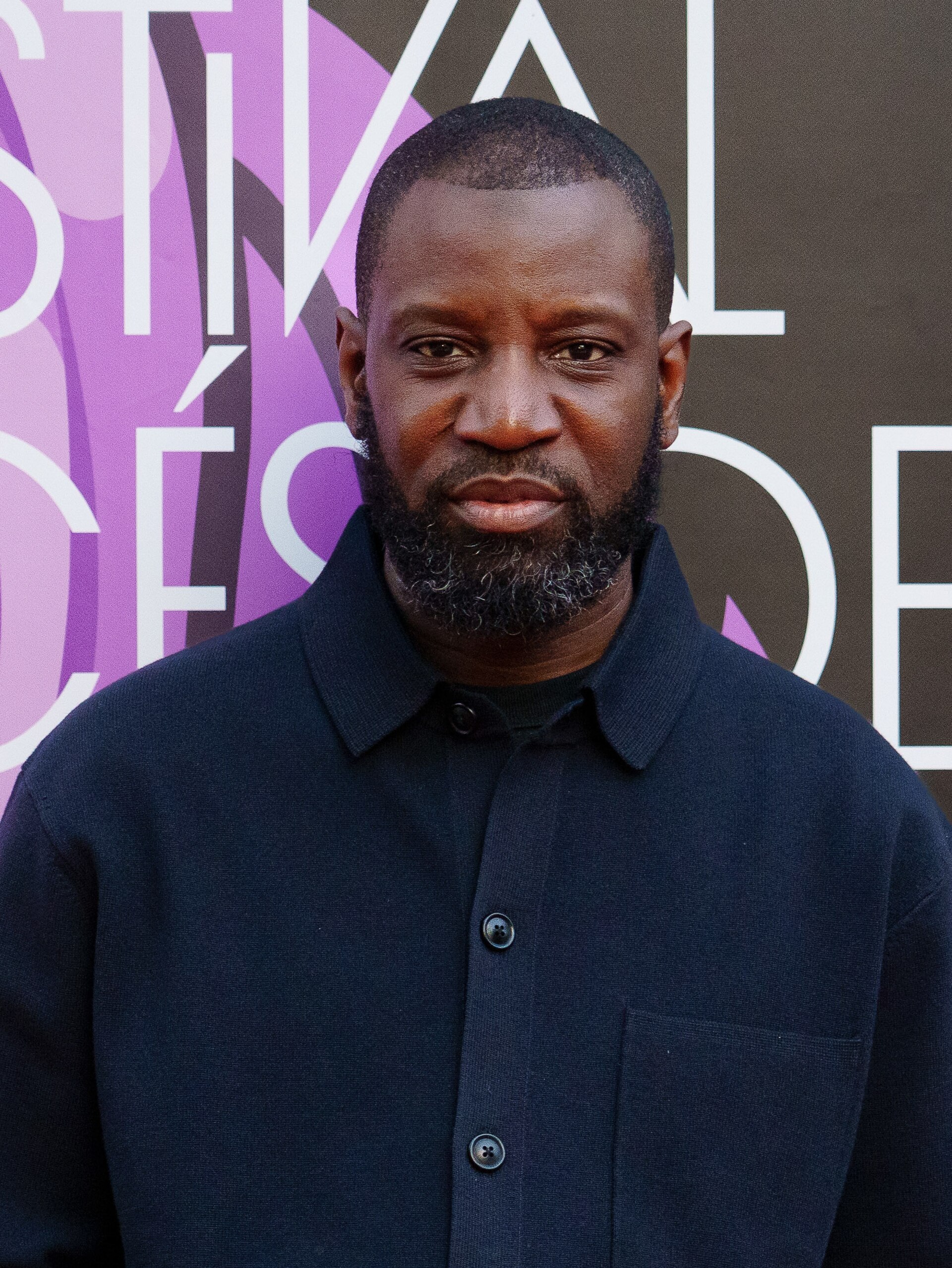 Abd Al Malik on the red carpet at the 2025 Malaga French Film Festival next to the Albéniz Cinema