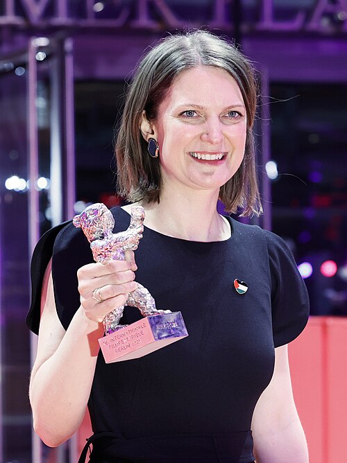 Geneviève Dulude-de Celles poses with the Silver Bear for Best Screenplay for “Nina Roza“ on the red carpet after the Award Ceremony of Berlinale 2026 in Berlin, Germany