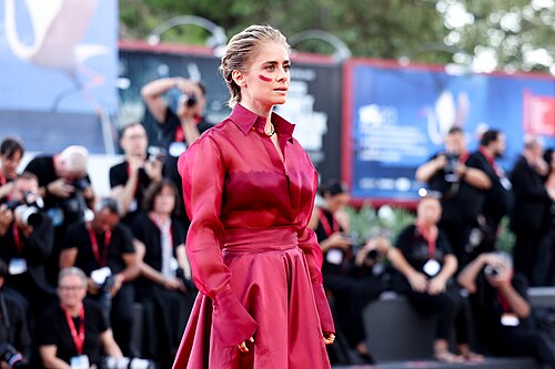Greta Scarano on the Venice red carpet against violence against women