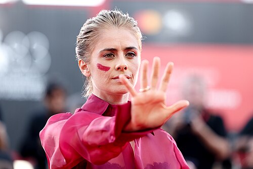 Greta Scarano on the Venice red carpet against violence against women