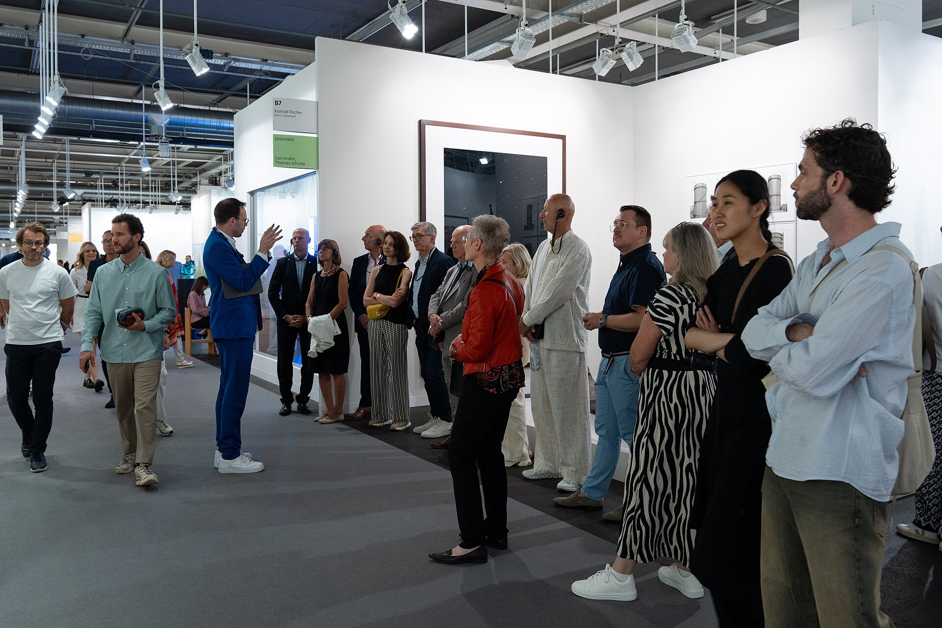 Guided tour group at the Konrad Fisher Gallery B7 at Art Basel 2025