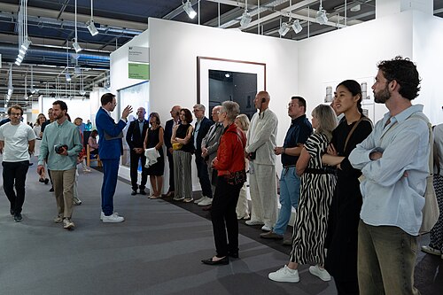 Guided tour group at the Konrad Fisher Gallery B7 at Art Basel 2025