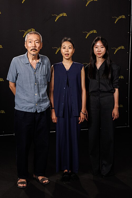 Hong Sang-soo, Kim Min-hee and Park Miso attend "Nun Dul Dega Eomne" photocall during the 79th Locarno Film Festival on August 13, 2026 in Locarno, Switzerland.