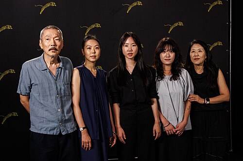 Hong Sang-soo, Kim Min-hee and Park Miso attend "Nun Dul Dega Eomne" photocall during the 79th Locarno Film Festival on August 13, 2026 in Locarno, Switzerland.