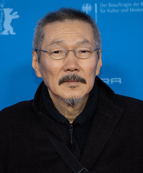 Director Hong Sangsoo on the red carpet at the premiere of The Day She Returns at the 2026 Berlin International Film Festival