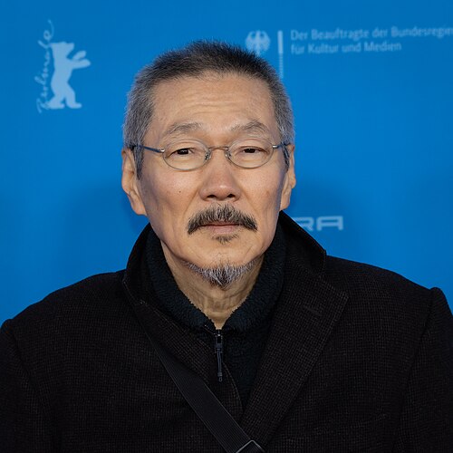Director Hong Sangsoo on the red carpet at the premiere of The Day She Returns at the 2026 Berlin International Film Festival
