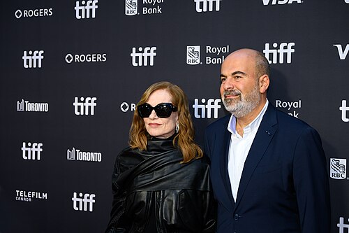 Isabelle Huppert and Marc Fitoussi pose together at the screening for "All About Corinne" at the 2026 Toronto International Film Festival.