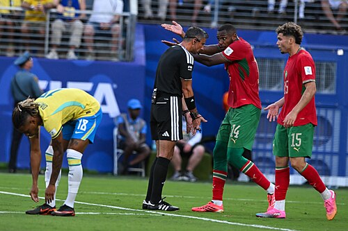 EAST RUTHERFORD, UNITED STATES - June 13: Referee Slavko Vinci argues with the Issa Diop and Samir El Mourabet of Morocco during the FIFA World Cup 2026 Group C match between Brazil and Morocco on June 13, 2026